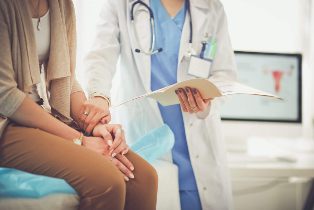 doctor holding a female patient's hand