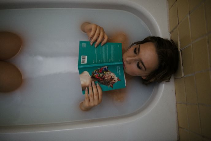 Relaxing bath with book