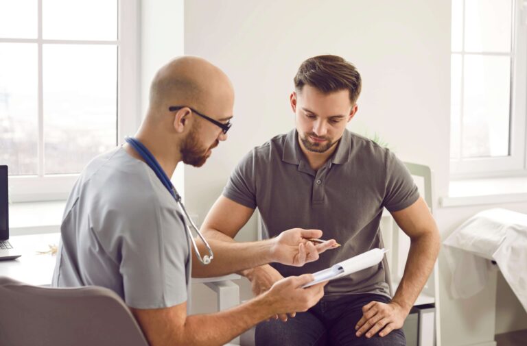 Doctor consulting male patient about prostate health