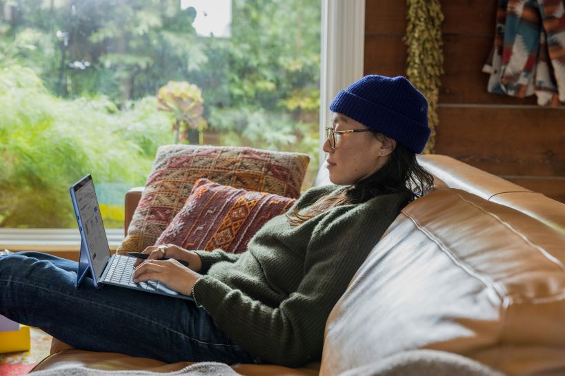 woman with laptop on couch
