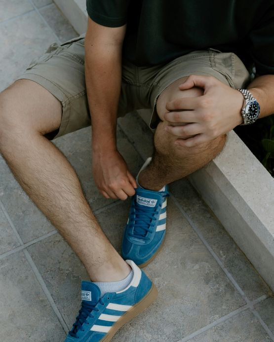 man holding his knee