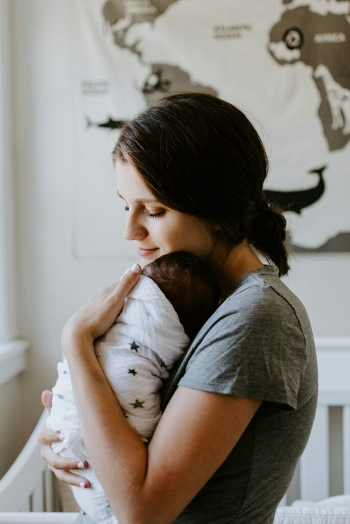 Woman holding newborn baby