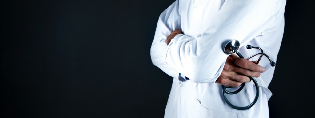 physician with arms crossed