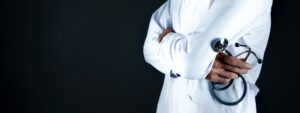 physician with arms crossed