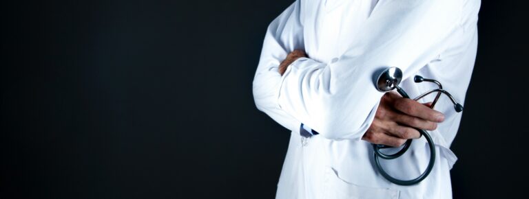 physician with arms crossed