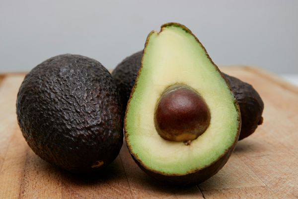 An avocado slide in half